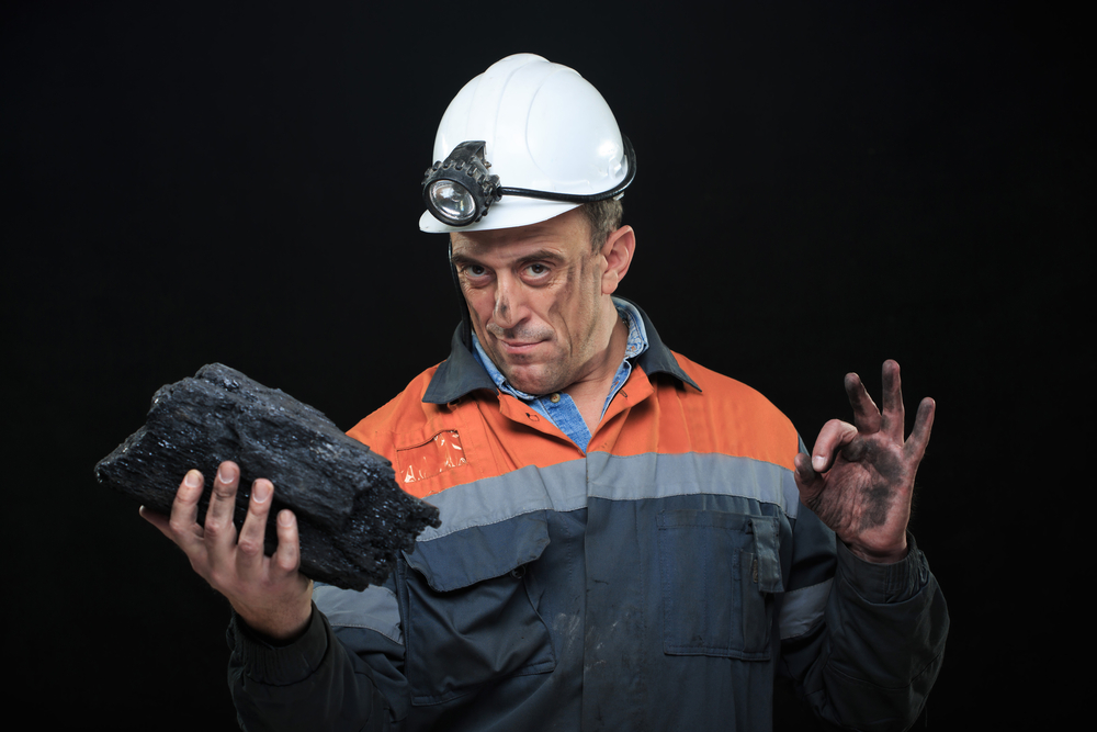 Coalminer Holds Out A Large Chunk Of Energy Rich Coal